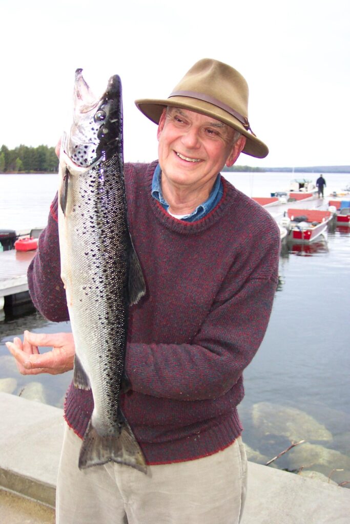 Holding one salmon