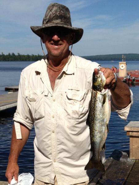 Fishing guide holding a fish